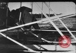 Image of Crowd gathered to watch Wright Flyer airplane demonstration in Le Mans France Le Mans France, 1908, second 40 stock footage video 65675055378