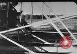 Image of Crowd gathered to watch Wright Flyer airplane demonstration in Le Mans France Le Mans France, 1908, second 41 stock footage video 65675055378