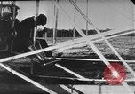 Image of Crowd gathered to watch Wright Flyer airplane demonstration in Le Mans France Le Mans France, 1908, second 44 stock footage video 65675055378
