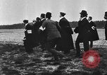 Image of Crowd gathered to watch Wright Flyer airplane demonstration in Le Mans France Le Mans France, 1908, second 50 stock footage video 65675055378