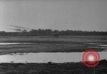 Image of Crowd gathered to watch Wright Flyer airplane demonstration in Le Mans France Le Mans France, 1908, second 53 stock footage video 65675055378