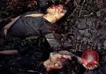 Image of dead Viet Cong Vietnam Vinh Te Canal, 1969, second 35 stock footage video 65675055543