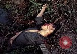 Image of dead Viet Cong Vietnam Vinh Te Canal, 1969, second 39 stock footage video 65675055543