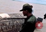 Immagine di Imbarcazione di pattuglia marinai di Fiume Il Vietnam Binh Thuy Air Base, 1967, secondo 24 filmato di repertorio 65675055547
