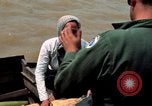 Immagine di Imbarcazione di pattuglia marinai di Fiume Il Vietnam Binh Thuy Air Base, 1967, secondo 29 filmato di repertorio 65675055547