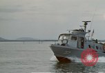Image of explosions along riverbank Vietnam, 1966, second 9 stock footage video 65675055555