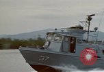 Image of explosions along riverbank Vietnam, 1966, second 12 stock footage video 65675055555