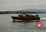 Image of explosions along riverbank Vietnam, 1966, second 17 stock footage video 65675055555