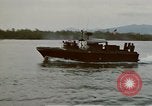 Image of explosions along riverbank Vietnam, 1966, second 18 stock footage video 65675055555