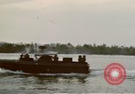 Image of explosions along riverbank Vietnam, 1966, second 23 stock footage video 65675055555