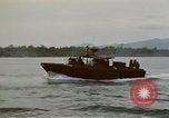 Image of explosions along riverbank Vietnam, 1966, second 32 stock footage video 65675055555