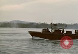Image of explosions along riverbank Vietnam, 1966, second 37 stock footage video 65675055555