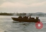 Image of explosions along riverbank Vietnam, 1966, second 40 stock footage video 65675055555