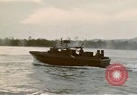 Image of explosions along riverbank Vietnam, 1966, second 41 stock footage video 65675055555