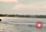 Image of explosions along riverbank Vietnam, 1966, second 45 stock footage video 65675055555