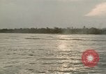 Image of explosions along riverbank Vietnam, 1966, second 48 stock footage video 65675055555