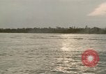 Image of explosions along riverbank Vietnam, 1966, second 51 stock footage video 65675055555