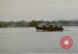 Image of explosions along riverbank Vietnam, 1966, second 55 stock footage video 65675055555