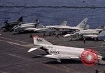 Image of U.S. Navy aircraft on flight deck of an aircraft carrier South China Sea, 1966, second 1 stock footage video 65675055557