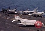 Image of U.S. Navy aircraft on flight deck of an aircraft carrier South China Sea, 1966, second 3 stock footage video 65675055557