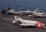 Image of U.S. Navy aircraft on flight deck of an aircraft carrier South China Sea, 1966, second 4 stock footage video 65675055557