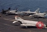 Image of U.S. Navy aircraft on flight deck of an aircraft carrier South China Sea, 1966, second 5 stock footage video 65675055557