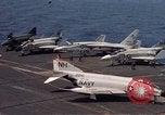 Image of U.S. Navy aircraft on flight deck of an aircraft carrier South China Sea, 1966, second 6 stock footage video 65675055557