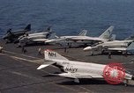 Image of U.S. Navy aircraft on flight deck of an aircraft carrier South China Sea, 1966, second 10 stock footage video 65675055557