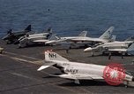 Image of U.S. Navy aircraft on flight deck of an aircraft carrier South China Sea, 1966, second 13 stock footage video 65675055557