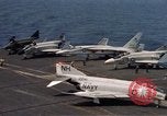 Image of U.S. Navy aircraft on flight deck of an aircraft carrier South China Sea, 1966, second 14 stock footage video 65675055557