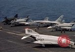 Image of U.S. Navy aircraft on flight deck of an aircraft carrier South China Sea, 1966, second 15 stock footage video 65675055557