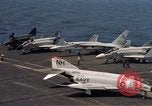 Image of U.S. Navy aircraft on flight deck of an aircraft carrier South China Sea, 1966, second 16 stock footage video 65675055557
