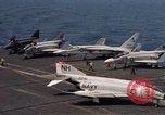 Image of U.S. Navy aircraft on flight deck of an aircraft carrier South China Sea, 1966, second 17 stock footage video 65675055557
