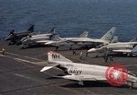 Image of U.S. Navy aircraft on flight deck of an aircraft carrier South China Sea, 1966, second 18 stock footage video 65675055557