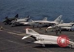Image of U.S. Navy aircraft on flight deck of an aircraft carrier South China Sea, 1966, second 19 stock footage video 65675055557