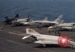 Image of U.S. Navy aircraft on flight deck of an aircraft carrier South China Sea, 1966, second 21 stock footage video 65675055557