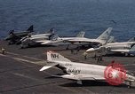 Image of U.S. Navy aircraft on flight deck of an aircraft carrier South China Sea, 1966, second 22 stock footage video 65675055557