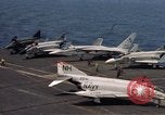 Image of U.S. Navy aircraft on flight deck of an aircraft carrier South China Sea, 1966, second 23 stock footage video 65675055557