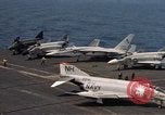 Image of U.S. Navy aircraft on flight deck of an aircraft carrier South China Sea, 1966, second 27 stock footage video 65675055557