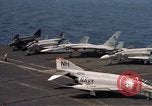 Image of U.S. Navy aircraft on flight deck of an aircraft carrier South China Sea, 1966, second 31 stock footage video 65675055557