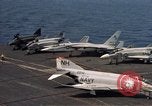 Image of U.S. Navy aircraft on flight deck of an aircraft carrier South China Sea, 1966, second 34 stock footage video 65675055557