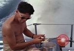 Image of crew men aboard Swift boat An Thoi Phu Quoc Vietnam, 1966, second 25 stock footage video 65675055562