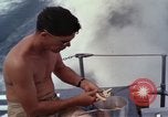 Image of crew men aboard Swift boat An Thoi Phu Quoc Vietnam, 1966, second 26 stock footage video 65675055562