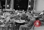 Image of American soldiers at French cafe Le Mans France, 1944, second 15 stock footage video 65675055594