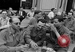 Image of American soldiers at French cafe Le Mans France, 1944, second 20 stock footage video 65675055594