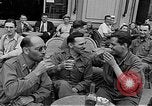 Image of American soldiers at French cafe Le Mans France, 1944, second 22 stock footage video 65675055594