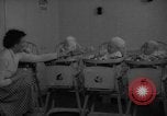Image of quadruplets in cots Holland Netherlands, 1959, second 8 stock footage video 65675055806