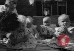 Image of quadruplets in cots Holland Netherlands, 1959, second 53 stock footage video 65675055806