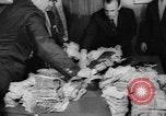 Image of over two million dollars discovered in car Jersey City New Jersey USA, 1962, second 32 stock footage video 65675055863