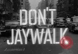 Image of accidents due to jaywalking United States USA, 1961, second 27 stock footage video 65675055897